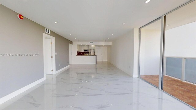 3625 N Country Club Dr Unit 609, Aventura, FL 33180 - unfurnished room featuring light marble finish floors, baseboards, and recessed lighting