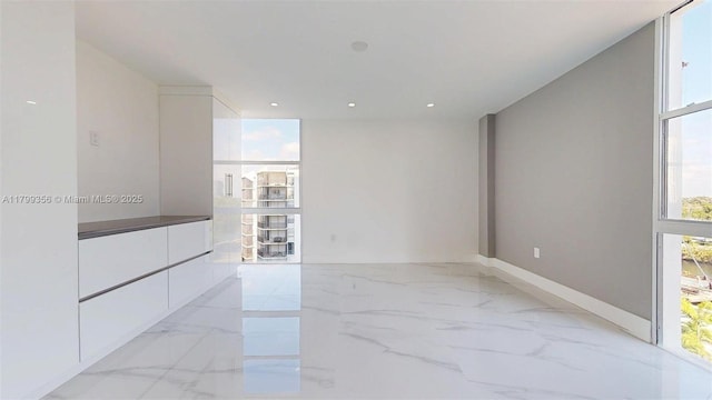 3625 N Country Club Dr Unit 609, Aventura, FL 33180 - empty room with light marble finish flooring and baseboards