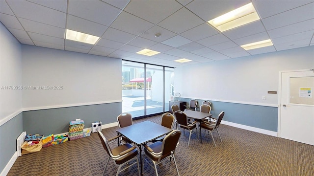 3625 N Country Club Dr Unit 609, Aventura, FL 33180 - dining space with carpet flooring, baseboards, and a drop ceiling