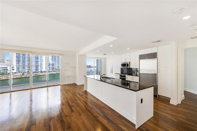 901 Brickell Key Blvd Unit 607, Miami, FL 33131 - kitchen with appliances with stainless steel finishes, a sink, dark wood-style floors, white cabinetry, and baseboards