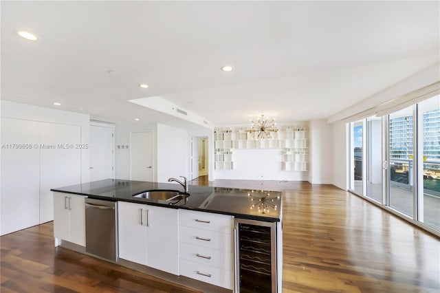 901 Brickell Key Blvd Unit 607, Miami, FL 33131 - kitchen with beverage cooler, stainless steel dishwasher, a sink, dark wood-type flooring, and recessed lighting