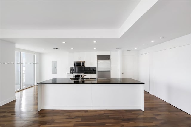 901 Brickell Key Blvd Unit 607, Miami, FL 33131 - kitchen featuring appliances with stainless steel finishes, white cabinets, dark countertops, recessed lighting, and dark wood-style floors