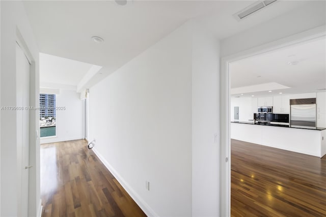 901 Brickell Key Blvd Unit 607, Miami, FL 33131 - corridor featuring dark wood-type flooring, baseboards, and recessed lighting