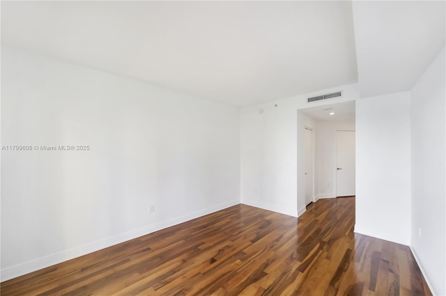 901 Brickell Key Blvd Unit 607, Miami, FL 33131 - unfurnished room with wood finished floors and baseboards