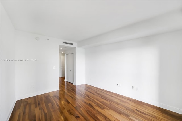 901 Brickell Key Blvd Unit 607, Miami, FL 33131 - empty room featuring wood finished floors and baseboards