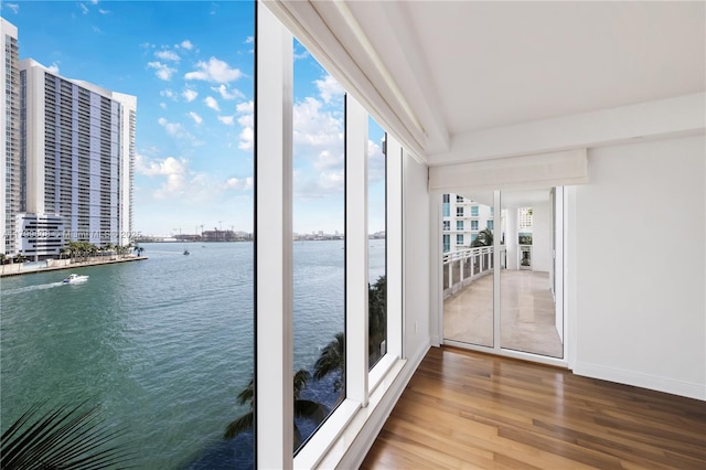 901 Brickell Key Blvd Unit 607, Miami, FL 33131 - unfurnished sunroom featuring a water view