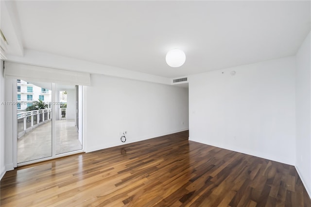 901 Brickell Key Blvd Unit 607, Miami, FL 33131 - unfurnished room with wood finished floors and baseboards
