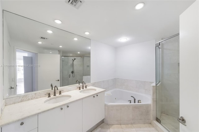 901 Brickell Key Blvd Unit 607, Miami, FL 33131 - full bathroom featuring a stall shower, a garden tub, double vanity, tile patterned floors, and recessed lighting