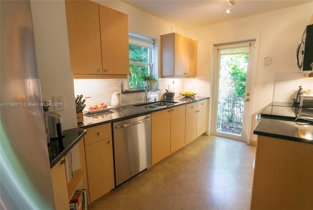 246 NE 92nd St, Miami Shores, FL 33138 - kitchen with appliances with stainless steel finishes, a sink, decorative backsplash, and plenty of natural light