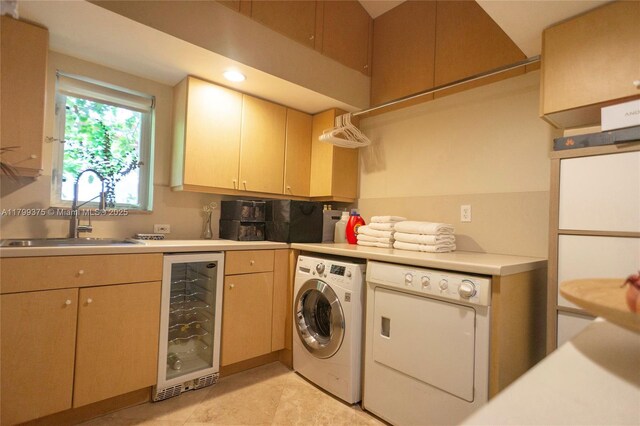 246 NE 92nd St, Miami Shores, FL 33138 - washroom with beverage cooler, cabinet space, washing machine and clothes dryer, recessed lighting, and light tile patterned floors
