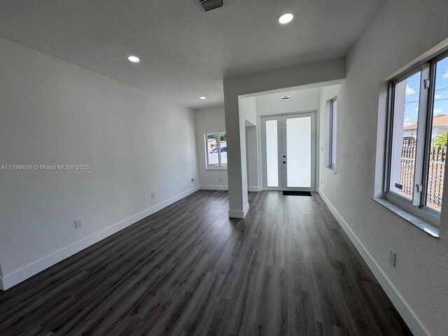 3039 NW 51st Ter, Miami, FL 33142 - entrance foyer with dark wood finished floors, baseboards, recessed lighting, and a textured wall