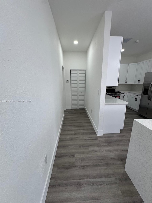 3039 NW 51st Ter, Miami, FL 33142 - hallway with baseboards, dark wood-style floors, and recessed lighting