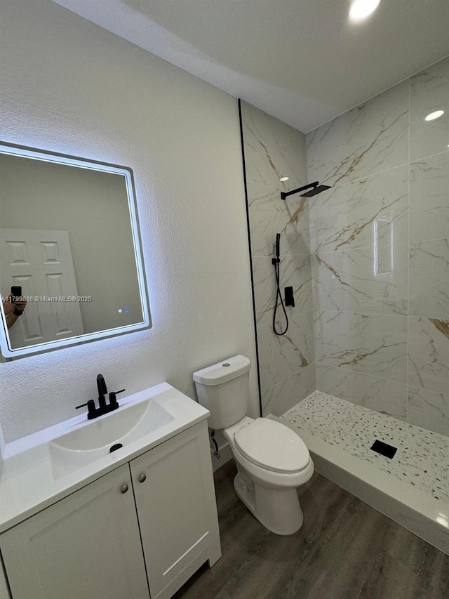 3039 NW 51st Ter, Miami, FL 33142 - bathroom with vanity, toilet, a marble finish shower, and wood finished floors