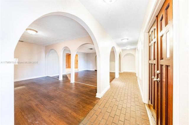 10840 NW 40th St, Coral Springs, FL 33065 - hall featuring baseboards and brick patterned floors