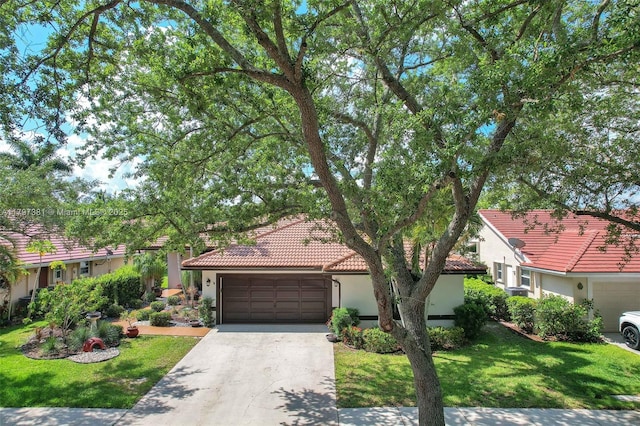 808 Hampton Ct, Weston, FL 33326 - mediterranean / spanish-style home featuring stucco siding, an attached garage, and a tile roof
