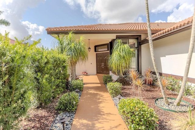 808 Hampton Ct, Weston, FL 33326 - property entrance with stucco siding and a tiled roof