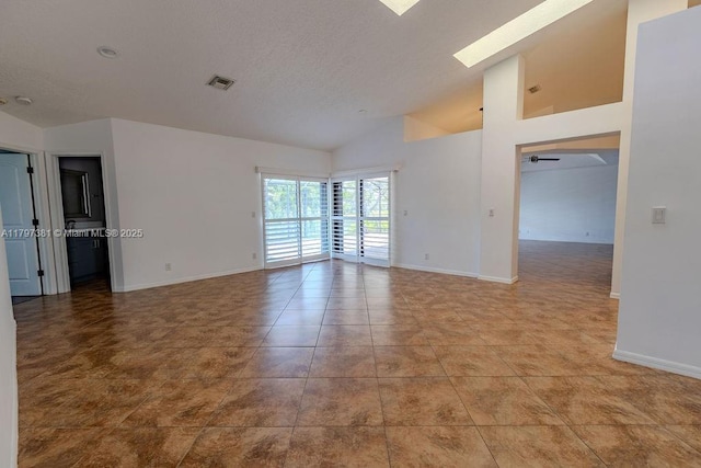 808 Hampton Ct, Weston, FL 33326 - spare room with baseboards, french doors, tile patterned flooring, and high vaulted ceiling