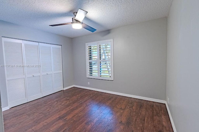 808 Hampton Ct, Weston, FL 33326 - unfurnished bedroom featuring dark wood-type flooring, baseboards, a closet, a textured ceiling, and ceiling fan