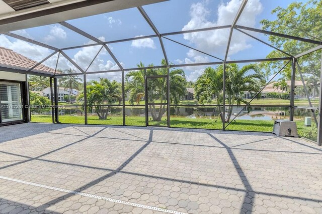 808 Hampton Ct, Weston, FL 33326 - view of patio featuring a water view and a lanai
