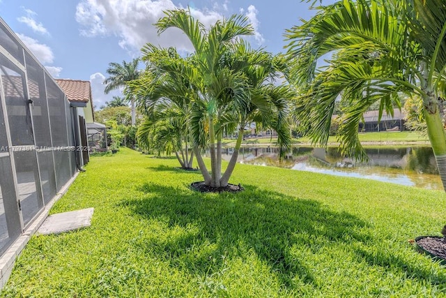 808 Hampton Ct, Weston, FL 33326 - view of grassy yard with a water view and glass enclosure