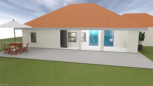 1729 NW 9th St, Cape Coral, FL 33993 - back of property with a patio area, a tile roof, and stucco siding
