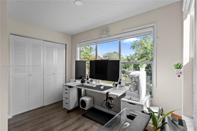 office space featuring wood finished floors and a textured ceiling