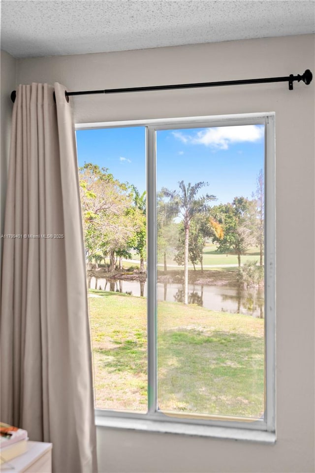 doorway to outside featuring a water view