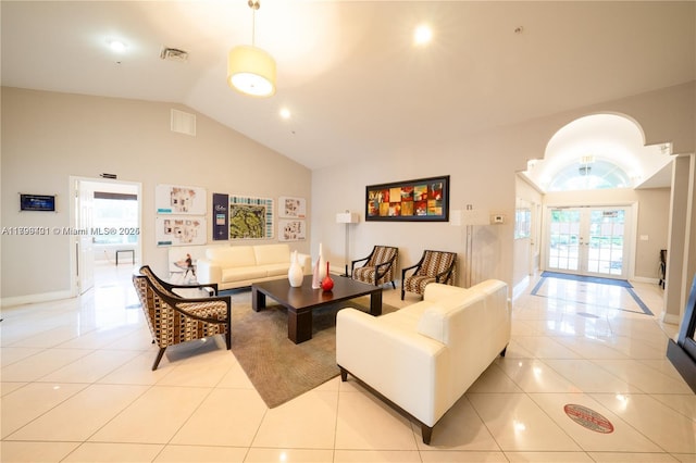 living room featuring tile patterned flooring, french doors, high vaulted ceiling, and baseboards