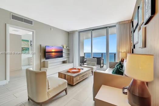 4111 S Ocean Dr Unit 3205, Hollywood, FL 33019 - living room featuring floor to ceiling windows