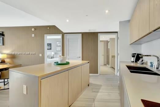 4111 S Ocean Dr Unit 3205, Hollywood, FL 33019 - kitchen featuring a sink, light countertops, a kitchen island, and modern cabinets