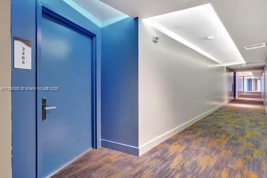 4111 S Ocean Dr Unit 3205, Hollywood, FL 33019 - hallway featuring baseboards and wood finished floors