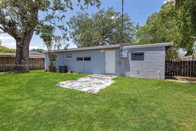 2811 N 66th Ave, Hollywood, FL 33024 - back of property featuring cooling unit, a patio, and stucco siding