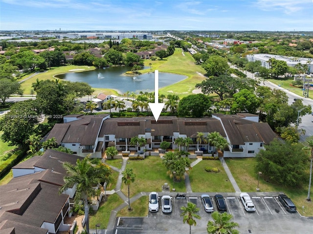 drone / aerial view of a large body of water and a golf course