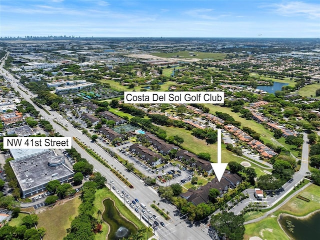 aerial overview of property's location with a large body of water and a local golf course