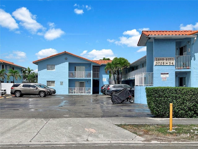 view of property with uncovered parking