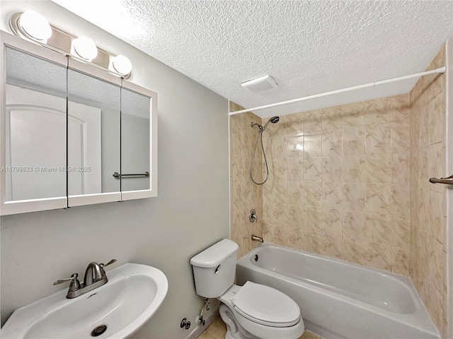 bathroom featuring a sink, a textured ceiling, toilet, and shower / bathtub combination