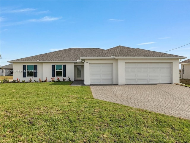 2048 NW 3rd Ter, Cape Coral, FL 33993 - view of front of property featuring stucco siding, decorative driveway, an attached garage, and a front lawn