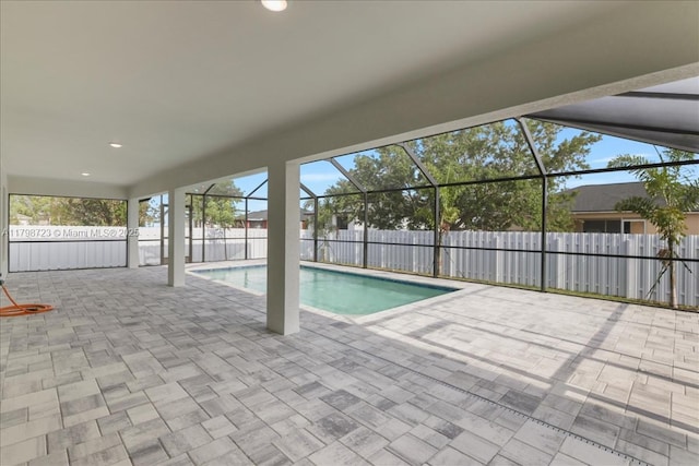 2048 NW 3rd Ter, Cape Coral, FL 33993 - view of swimming pool featuring a patio area, a fenced backyard, and a lanai