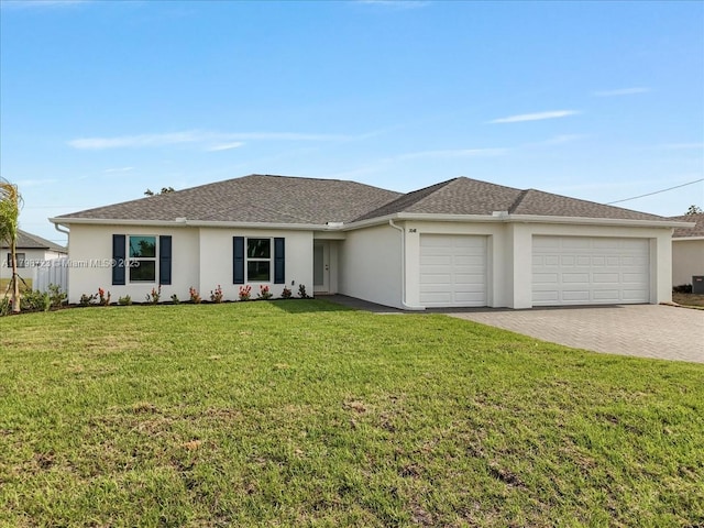 2048 NW 3rd Ter, Cape Coral, FL 33993 - view of front of property with stucco siding, a garage, and decorative driveway