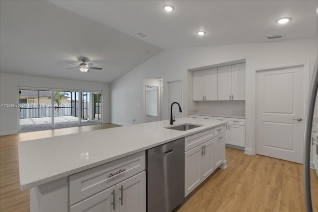 2048 NW 3rd Ter, Cape Coral, FL 33993 - kitchen featuring dishwasher, a sink, vaulted ceiling, white cabinets, and light wood-style flooring