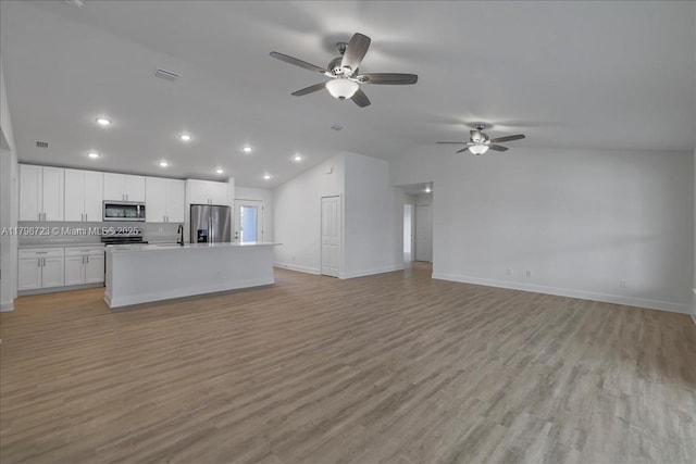 2048 NW 3rd Ter, Cape Coral, FL 33993 - unfurnished living room featuring a sink, a ceiling fan, light wood-type flooring, lofted ceiling, and recessed lighting