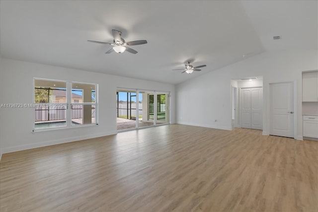 2048 NW 3rd Ter, Cape Coral, FL 33993 - unfurnished living room with ceiling fan, vaulted ceiling, light wood-style flooring, and baseboards