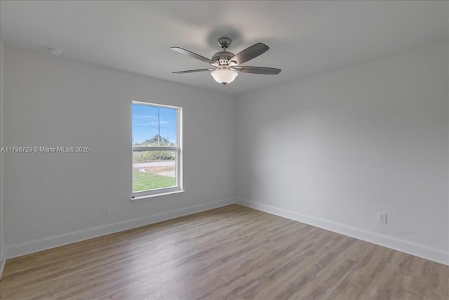 2048 NW 3rd Ter, Cape Coral, FL 33993 - empty room with baseboards, ceiling fan, light wood-style floors, and a smoke detector