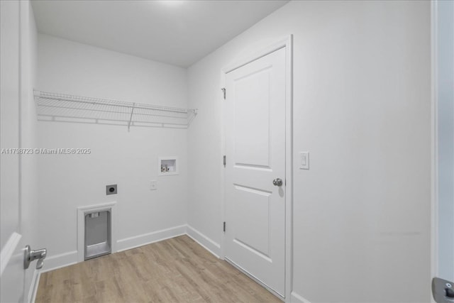 2048 NW 3rd Ter, Cape Coral, FL 33993 - clothes washing area featuring hookup for an electric dryer, hookup for a washing machine, light wood-style flooring, and baseboards