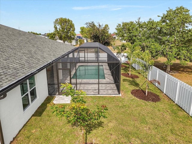 2048 NW 3rd Ter, Cape Coral, FL 33993 - back of property featuring a patio area, a shingled roof, stucco siding, and glass enclosure