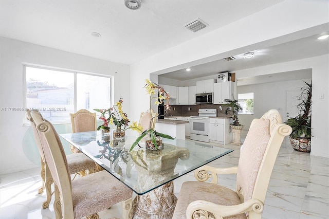 3241 SW 66th Ave, Miramar, FL 33023 - dining space with light marble finish floors, recessed lighting, and baseboards