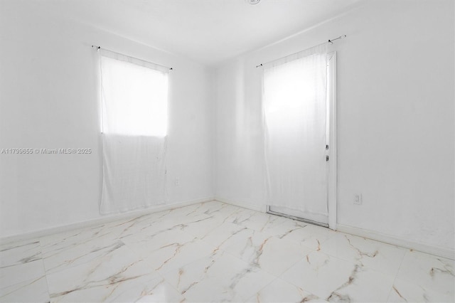 3241 SW 66th Ave, Miramar, FL 33023 - spare room featuring marble look tile flooring and baseboards