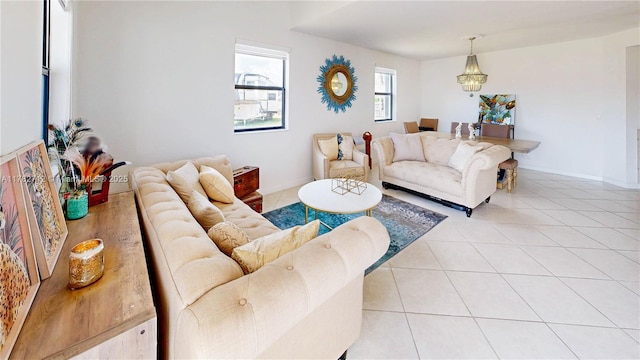 22986 SW 128th Pl, Miami, FL 33170 - living room with light tile patterned floors and a chandelier