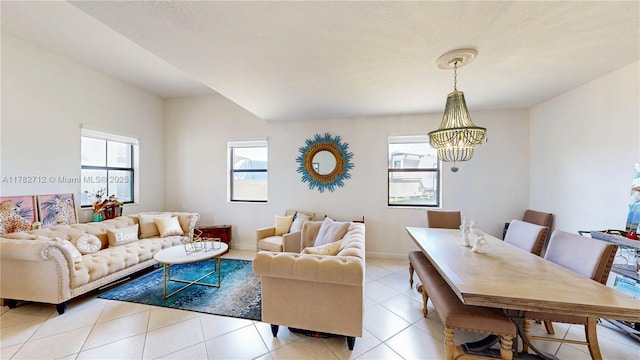 22986 SW 128th Pl, Miami, FL 33170 - living room featuring a chandelier, light tile patterned floors, and baseboards