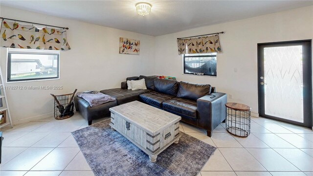 22986 SW 128th Pl, Miami, FL 33170 - living room featuring light tile patterned floors and baseboards